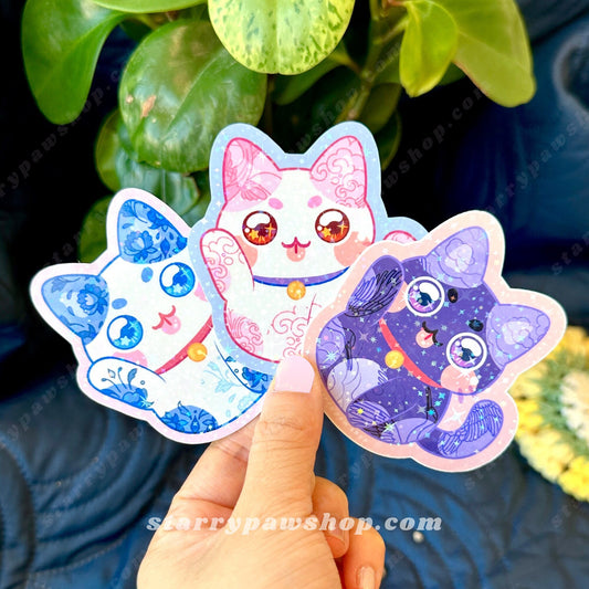Lucky Cat stickers in Blue floral porcelain, pink waves, and dark purple crane pattern.